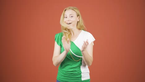 Woman-clapping-excitedly-to-camera.