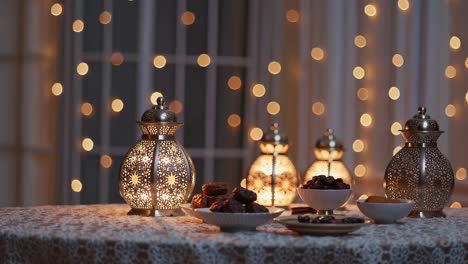 ornate golden lanterns creating warm, soft focused glow over traditional dates and festive table setting, representing peaceful ramadan evening atmosphere indoors