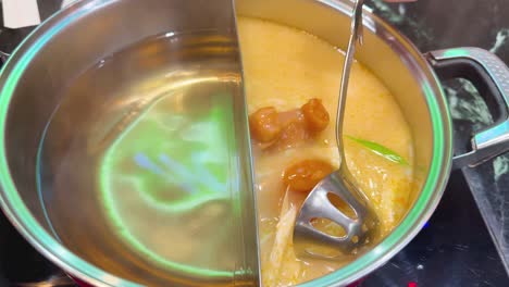 simmering hotpot soup with ingredients in bangkok