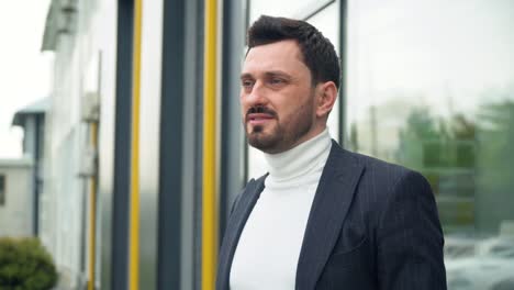 businessman stands near the business center. business concept