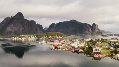 Orbiting-around-Reine-village,-bathing-in-beautiful-sunlight,-Reine,-Lofoten-Islands,-Norway