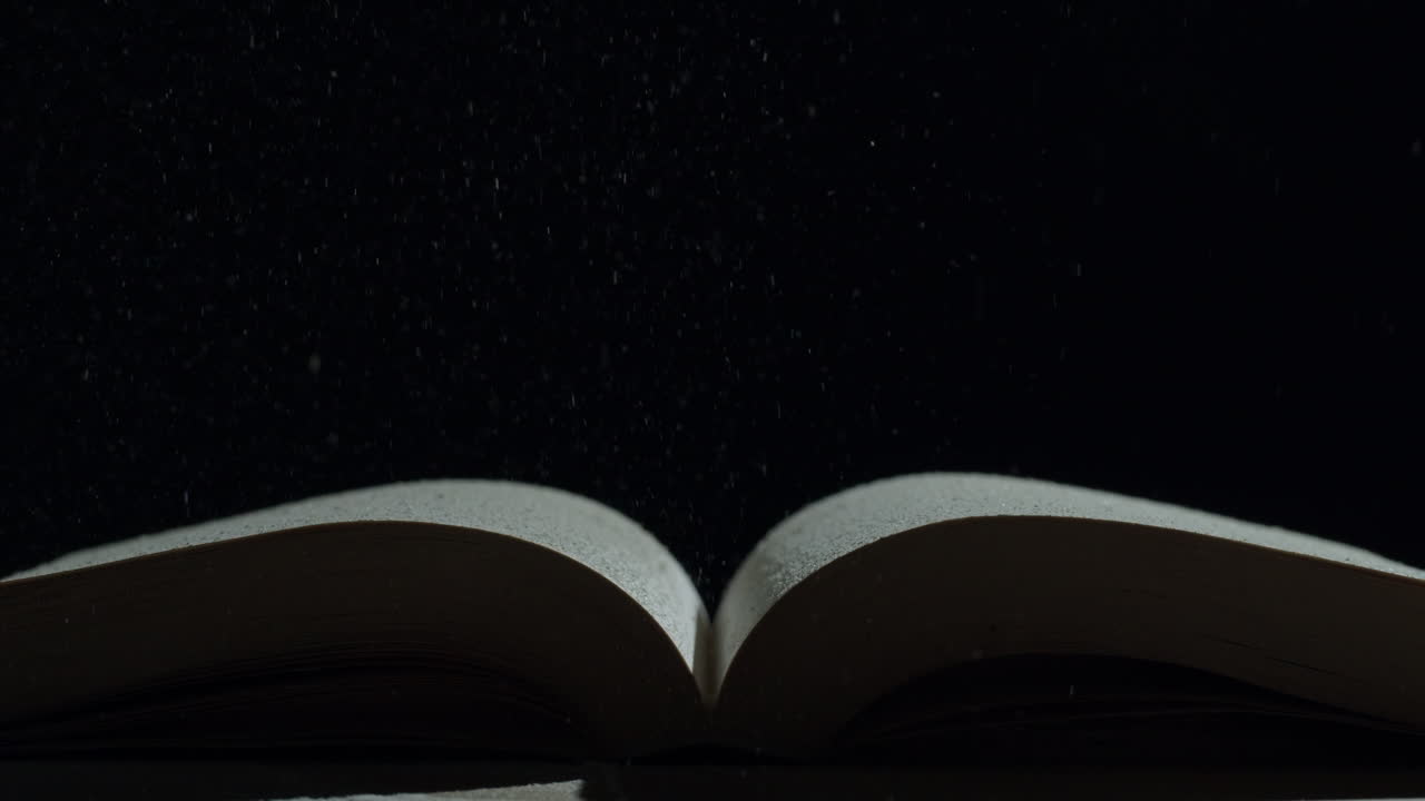 Open Book with Flying Dust
