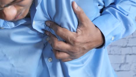 man experiencing chest pain