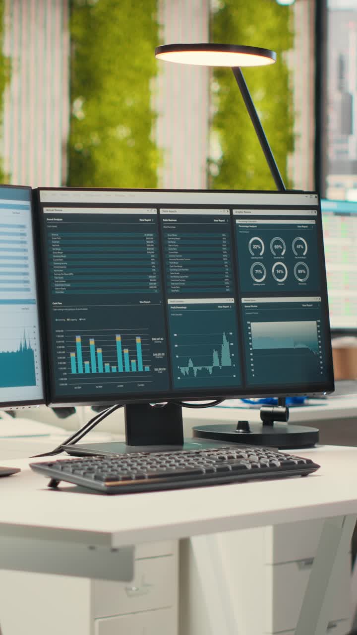 Vertical Video Empty business offices with dual monitors running financial diagnostics