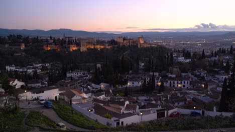 Blue-hour-scenery-over-Granada,-Spain-with-Alhambra-in-distance