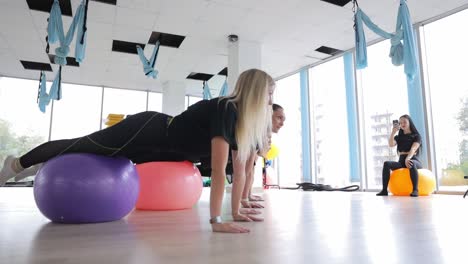 group fitness workout with exercise balls