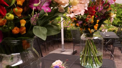 beautifully arranged flowers on a huge glass vase decorate during the wedding