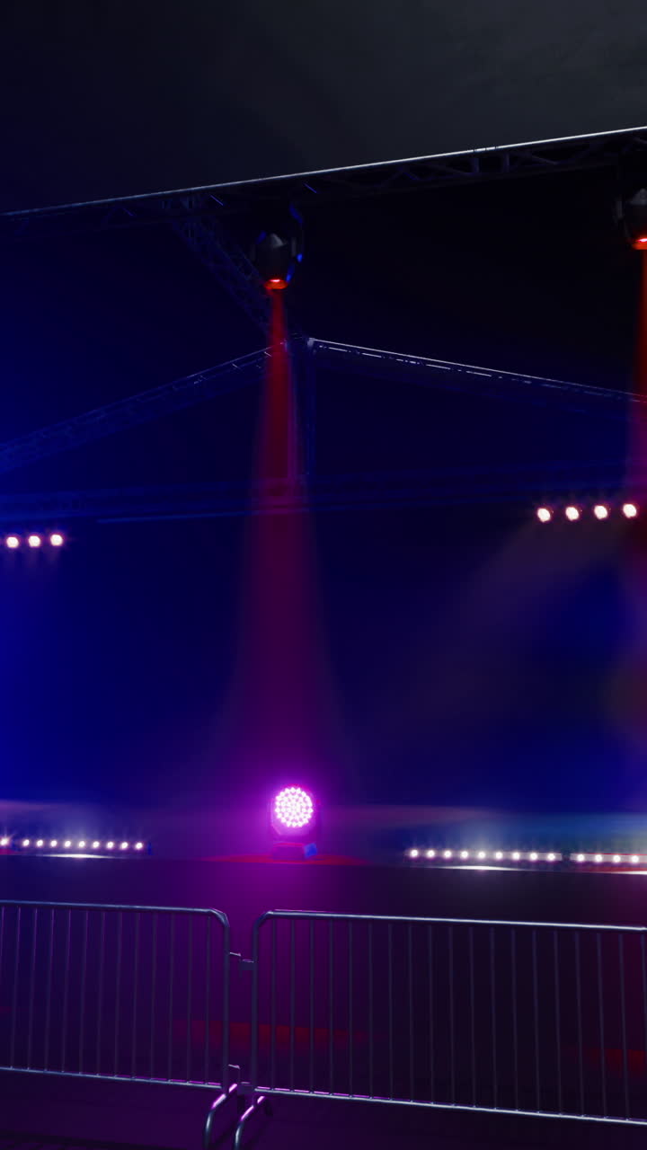 Colorful lighting setup for a live music event at an outdoor stage
