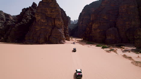 off-roading through massive rock mountains of tassili n'ajjer national park in southeastern algeria