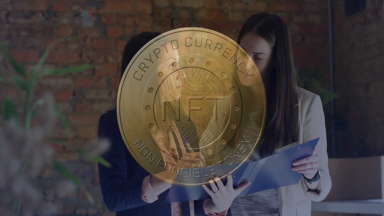 Two women reviewing documents in modern office, displaying gold NFT coin overlay for finance