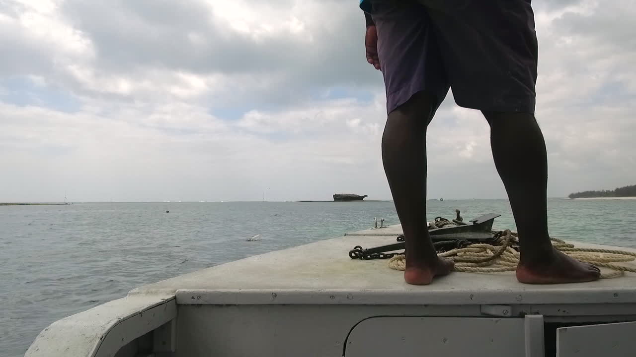 A boat sails the Indian Ocean in Watamu, Kenya.
