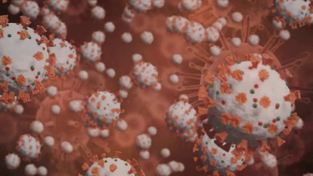 Animazione di macro cellule di coronavirus che si diffondono su sfondo blu