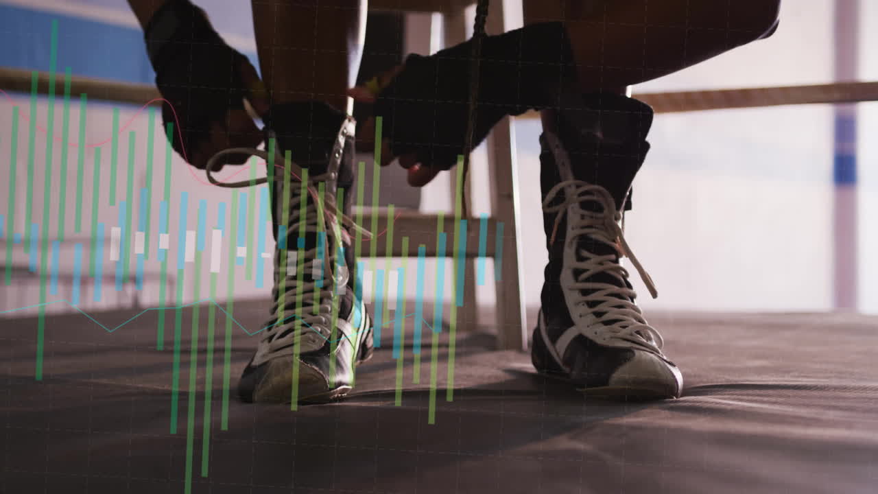 Boxer tying laces on boots with financial data animation overlay