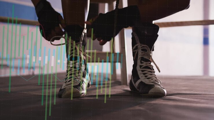 Boxer tying laces on boots with financial data animation overlay