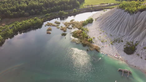 aerial landscape sand hills of quarry with a pond and abandoned prison in rummu estonia europe