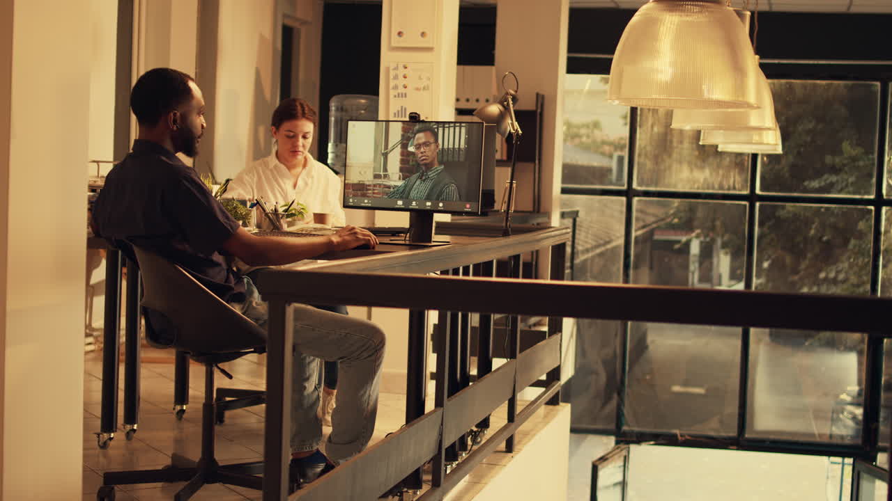 Manager talking to employee on online videocall