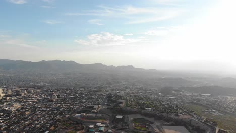 Aerial-drone-shot-of-El-Paso,-Texas,-looking-across-the-US-Mexico-border-and-into-Juarez,-Mexico