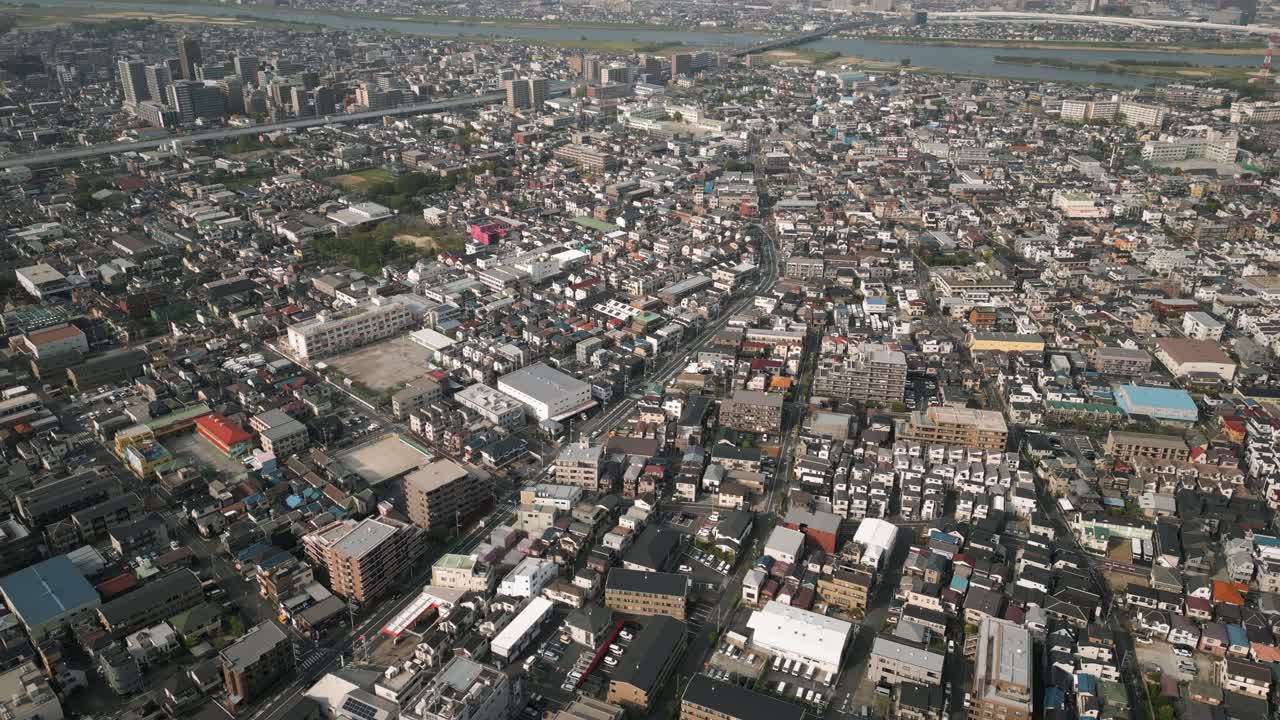Aerial Scenic Urban Drone Footage of a neighborhood, streets and buildings in the Capital City of Tokyo, Japan during Sunset
