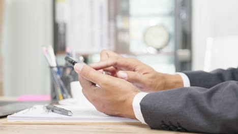 a young businessman is taking a video conference with customers via a smart phone connected to the internet.