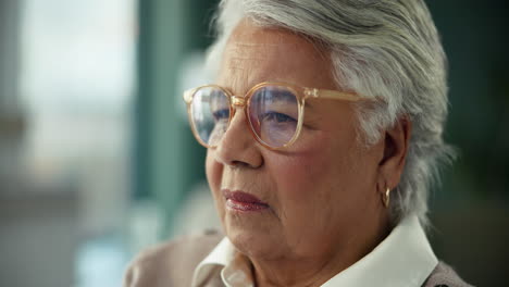 portrait of a senior woman wearing glasses