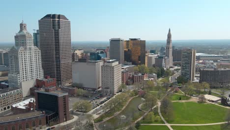 aerial drone shot in downtown hartford, connecticut, featuring the financial building and skyscrapers in the sunny afternoon