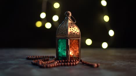 arabic lantern and tasbih (prayer beads beads)