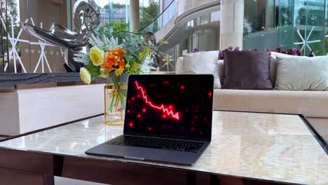 Laptop-with-Red-Arrow-Indicating-Economic-Recession-in-a-Luxurious-Mansion