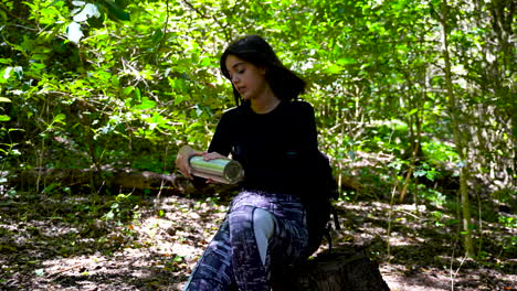 hiker girl having refreshing break