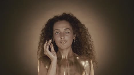 woman with golden body paint