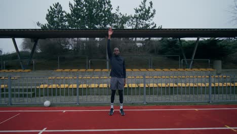 man exercising in a stadium