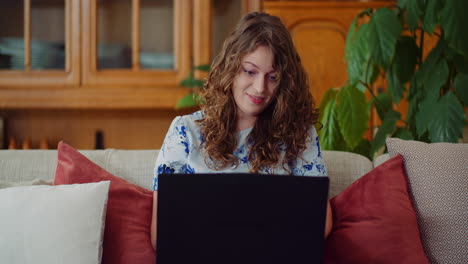 Medium-Shot-Of-Positive-Woman-Doing-Online-Work-From-Home