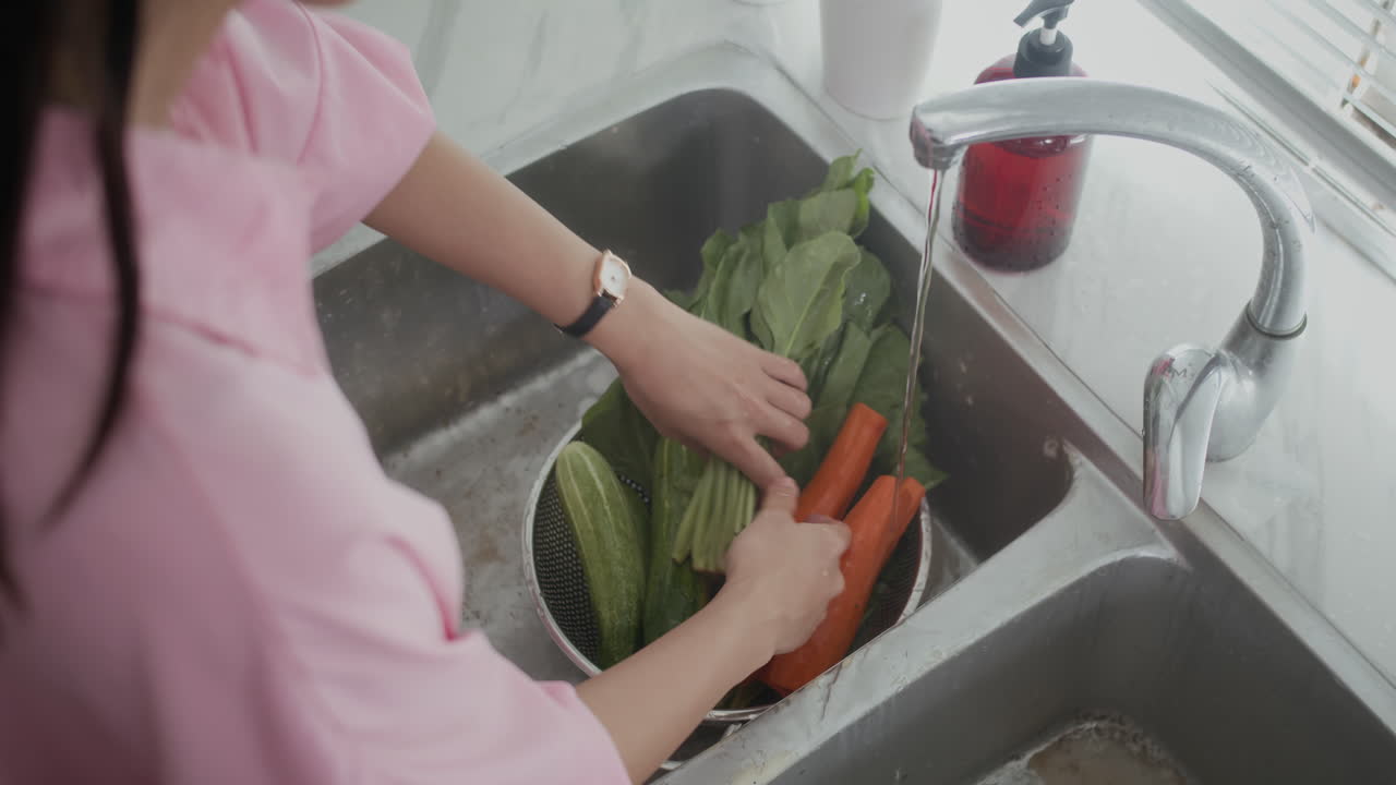 Unrecognizable Girl Rinsing Greenery and Vegetables