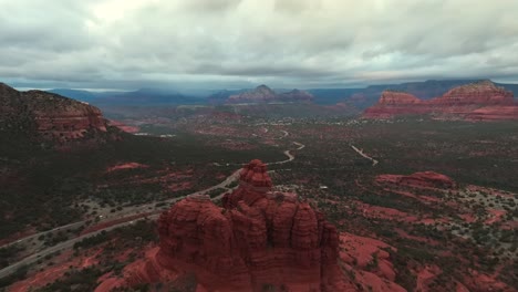 sandstone butte overlooking red rock scenic byway and bell rock trail in sedona, arizona