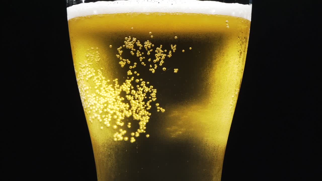 Cold Beer In A Glass With Water Drops. Craft Beer Close Up. Like rain water