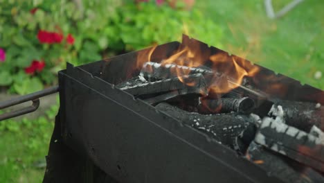 burning charcoal for barbeque in a garden