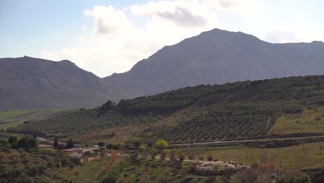 Beautiful-view-out-on-Spanish-countryside-with-hills,-mountains-and-rural-road