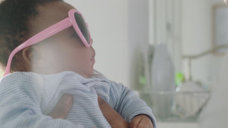 funny baby wearing sunglasses cute fashion toddler at home