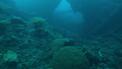 Inside-the-remains-of-shipwreck,-underwater-slow-motion