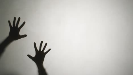 video of silhouettes of hands moving on white background