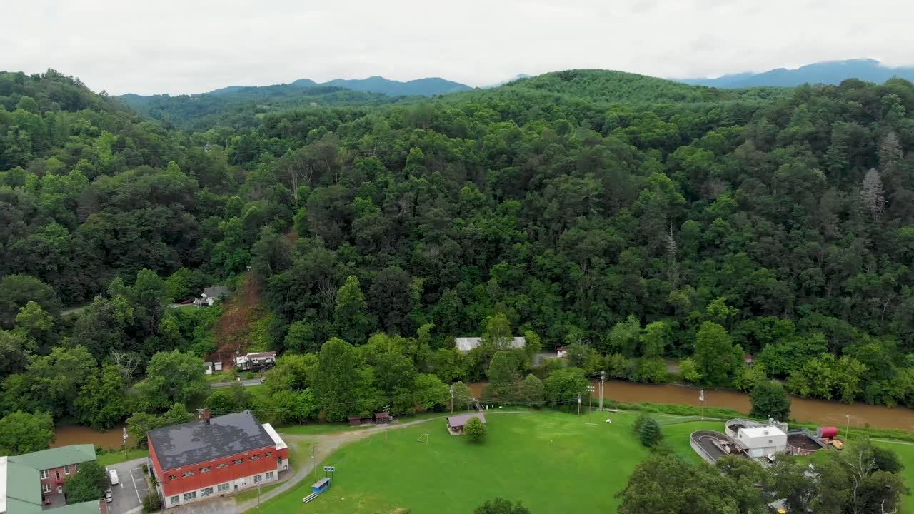 4K Aerial Drone Video of the French Broad River as it Flows Past Blannahasset Island Park in Historic Marshall, NC (2021)