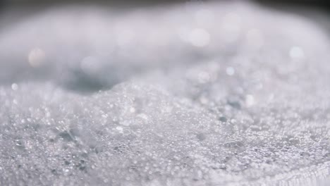 Artistic blur bubbles and dots with rotation slow motion and blue color copy space background