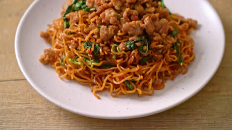 stir-fried instant noodles with thai basil and minced pork - asian food style