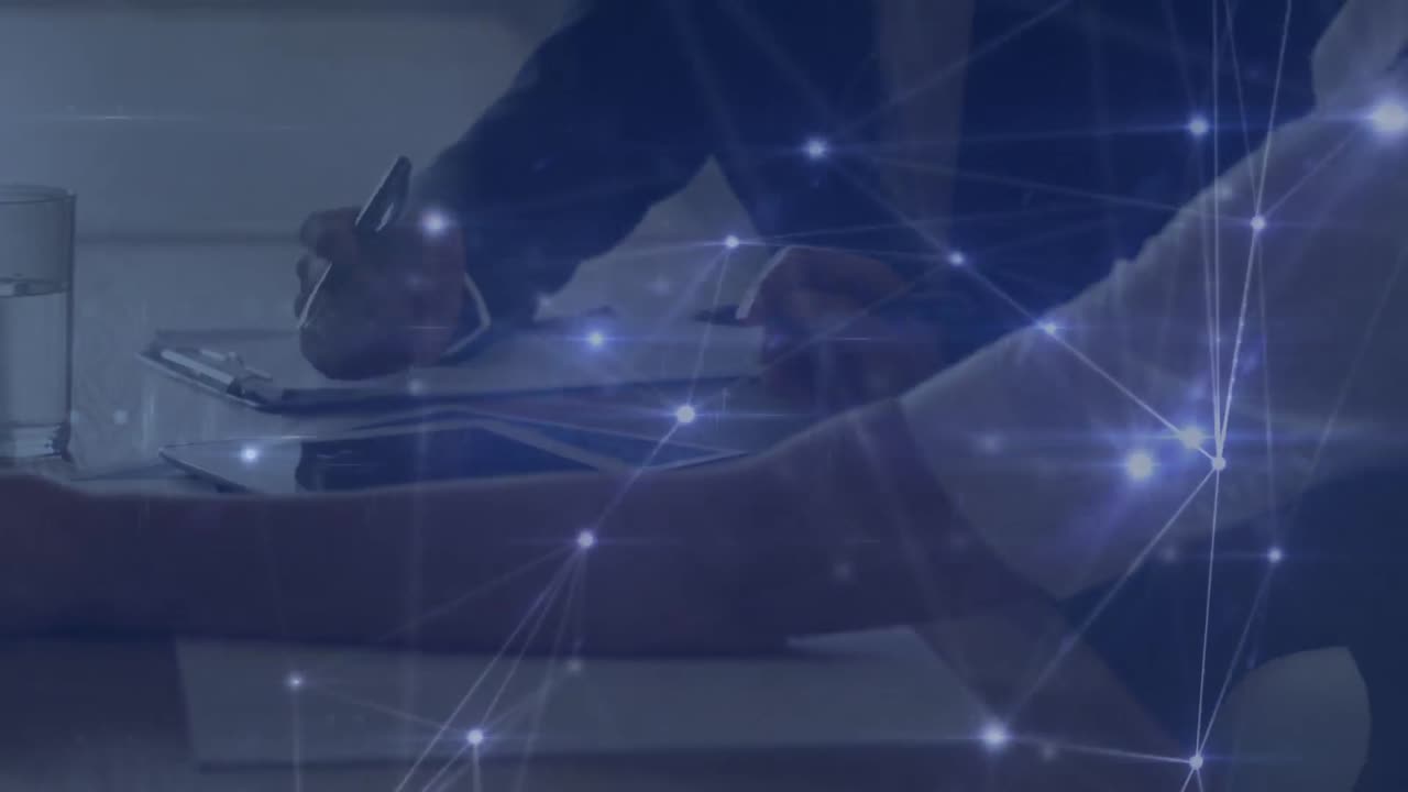 Animation of network of connections over hands of caucasian businesspeople working