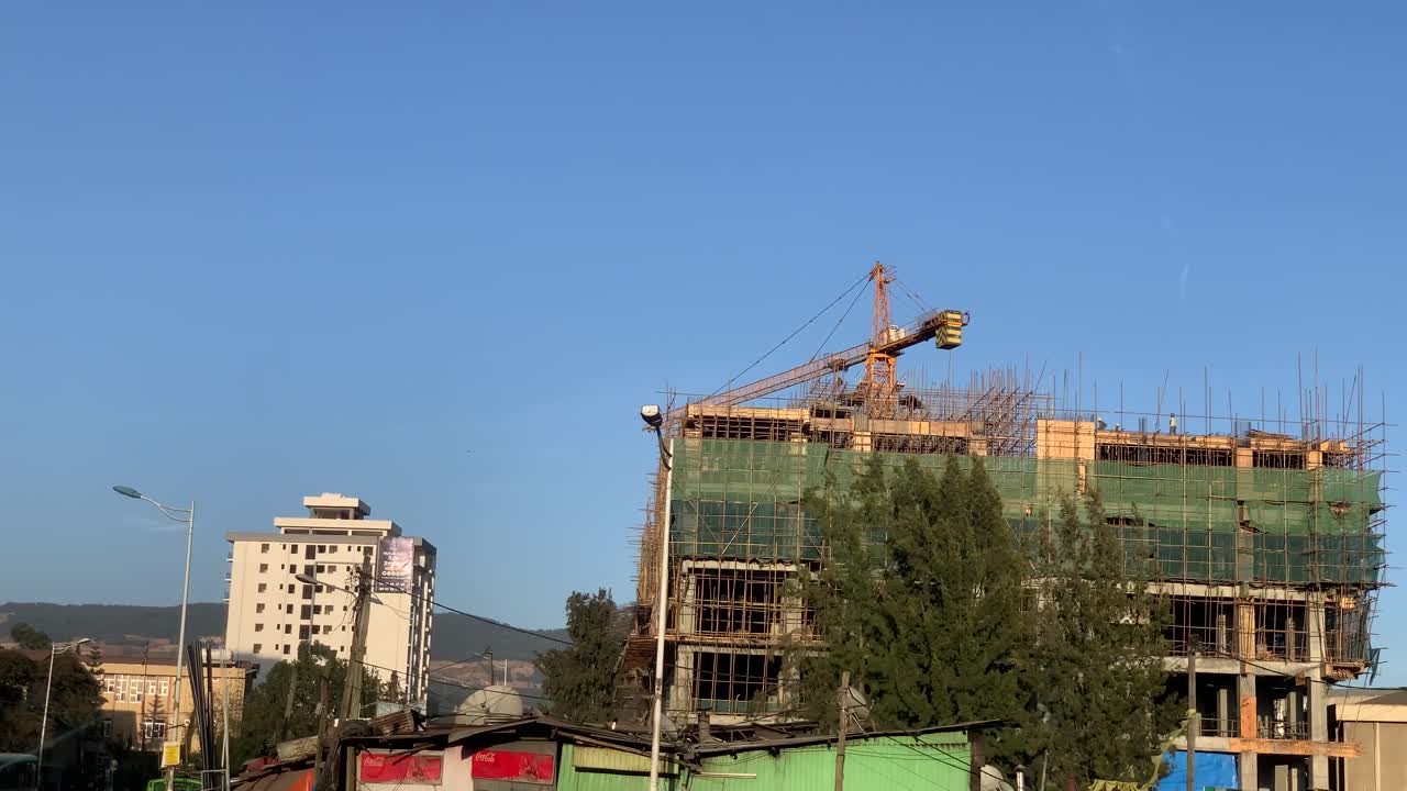 Building under construction with moving shot slide from moving car