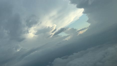 flying across a stormy sky as seen by the pilots of a jet, during a right turn at 8000m high