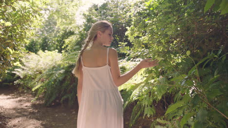 nature girl walking in forest young woman exploring lush garden enchanted by natural beauty outdoors 4k