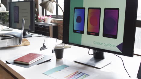 el monitor de la computadora en un entorno de oficina de negocios muestra las opciones de color para la aplicación de teléfono