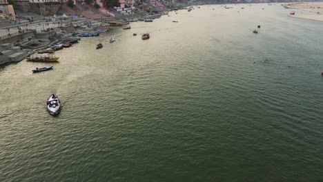 aerial shot of banaras with the ganga river, showcasing the sacred journey of pilgrims along the ghats.