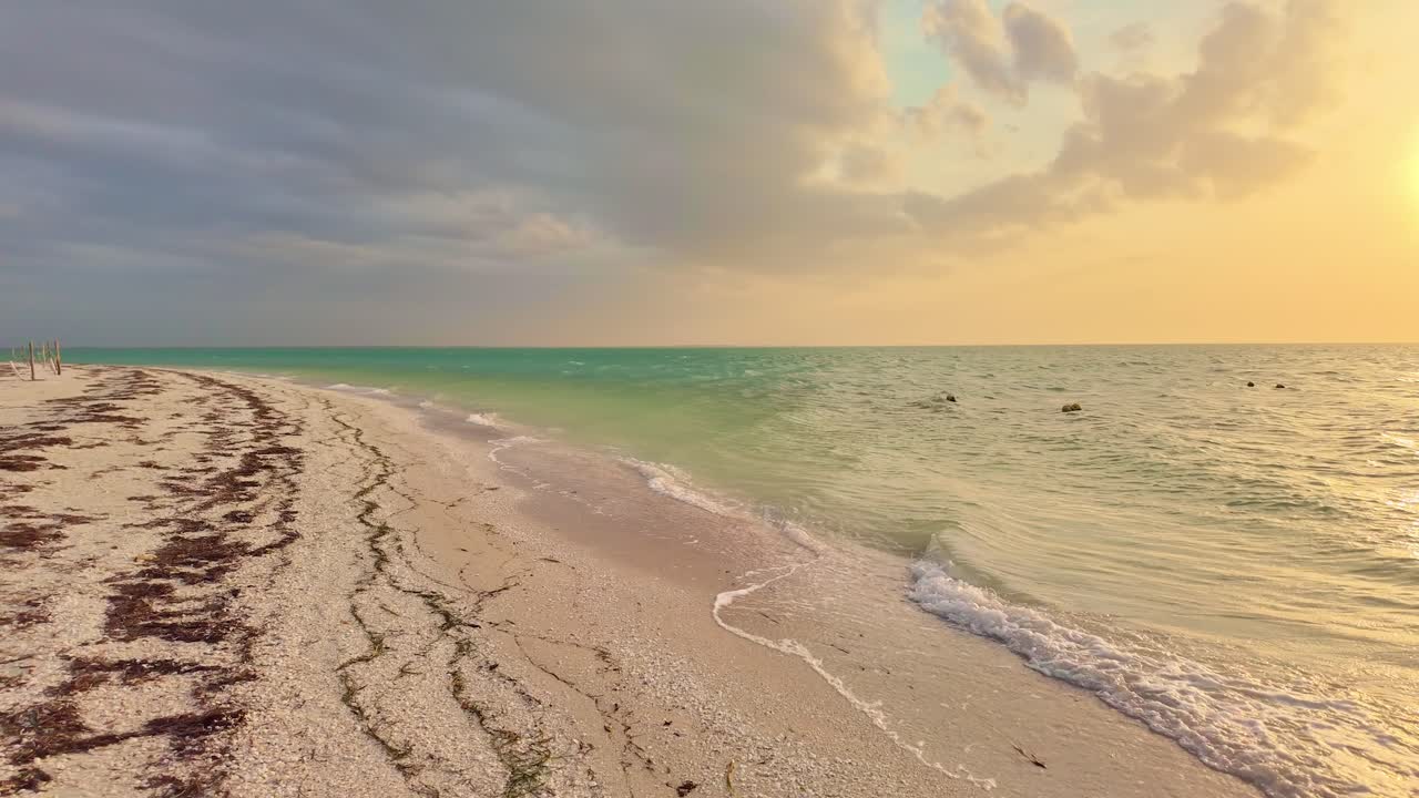 Beautiful sandy beach at Holbox Punta Cocos, Mexico during golden hour