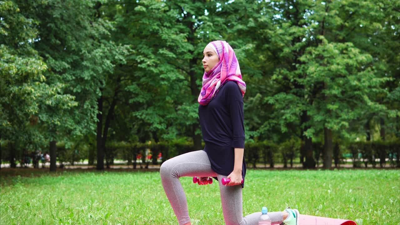 Muslim Woman Exercising Outdoors in a Park
